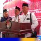 Caption: Amin Arif Tirtana (tengah) eks anggota DPRD Sampang dari PPP, saat konferensi pers di kantor KPU Sampang, (dok. regamedianews). 