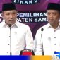 Caption: Cabup dan Cawabup Sampang 02, H.Slamet Junaidi - Ra Mahfud saat debat publik perdana di Surabaya, (dok. regamedianews). 