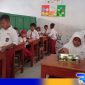 Caption: siswa SD di Kabupaten Bangkalan mulai merasakan program makan bergizi gratis, (dok. regamedianews). 