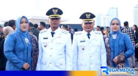 Caption: Bupati dan Wakil Bupati Bangkalan Lukman Hakim - Fauzan Dja'far pose bersama istri, (dok. regamedianews). 