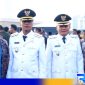 Caption: Bupati dan Wakil Bupati Bangkalan Lukman Hakim - Fauzan Dja'far pose bersama istri, (dok. regamedianews). 