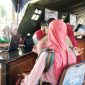 Caption: tampak petugas Puskemas Kamoning saat mendata dan memberikan layanan cek kesehatan gratis kepada masyarakat, (dok. regamedianews). 