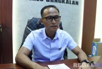 Caption: Kasat Reskrim Polres Bangkalan (AKP Hafid Dian Mashudi) saat diwawancara awak media di ruang kerjanya, (dok. regamedianews). 