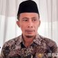 Caption: Kepala Dinas PUPR Kabupaten Pamekasan, Amin Jabir, (dok. regamedianews). 