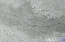 Caption: kondisi jalan rabat beton di Dusun Sumber Kuning Desa Jrengik tampak retak, (dok. regamedianews). 