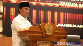 Caption: Bupati Bangkalan Lukman Hakim, sampaikan sambutan saat rapat paripurna di Gedung DPRD Bangkalan, (foto istimewa). 