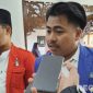 Caption: Homaidi aktivis Pergerakan Mahasiswa Islam Indonesia (PMII), saat diwawancara awak media, (dok. regamedianews). 