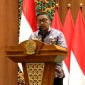 Caption: Sekda Bangkalan Ismet Effendi, sampaikan komitmennya perihal optimalisasi pajak dan retribusi daerah saat rapat paripurna DPRD Bangkalan, (dok. regamedianews). 
