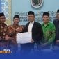 Caption: Dewan Syariah Nasional Majelis Ulama Indonesia (DSN-MUI) pose bersama usai gelar serah terima jabatan, (sumber foto: MUI digital). 